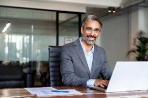 An Arlington Heights car accident lawyer sitting at his desk, waiting to help.